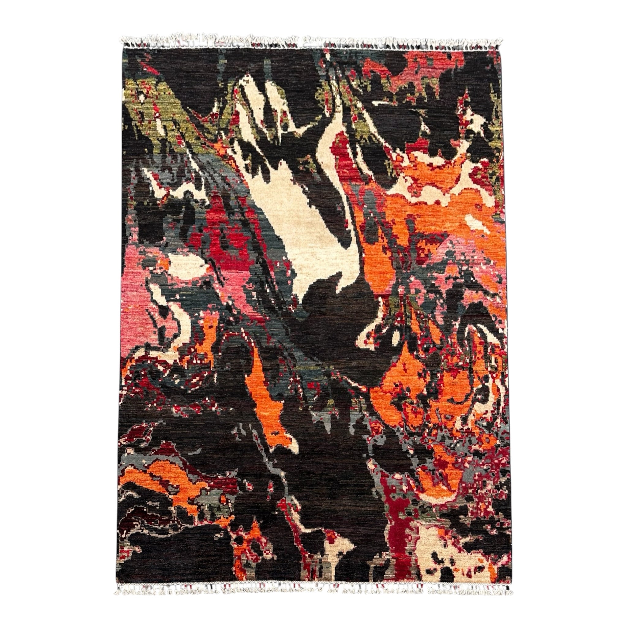 An abstract area rug with a hand-dyed, painterly pattern in black, orange, red, beige, and grey, featuring a colourful  fringe on the top and bottom edges.