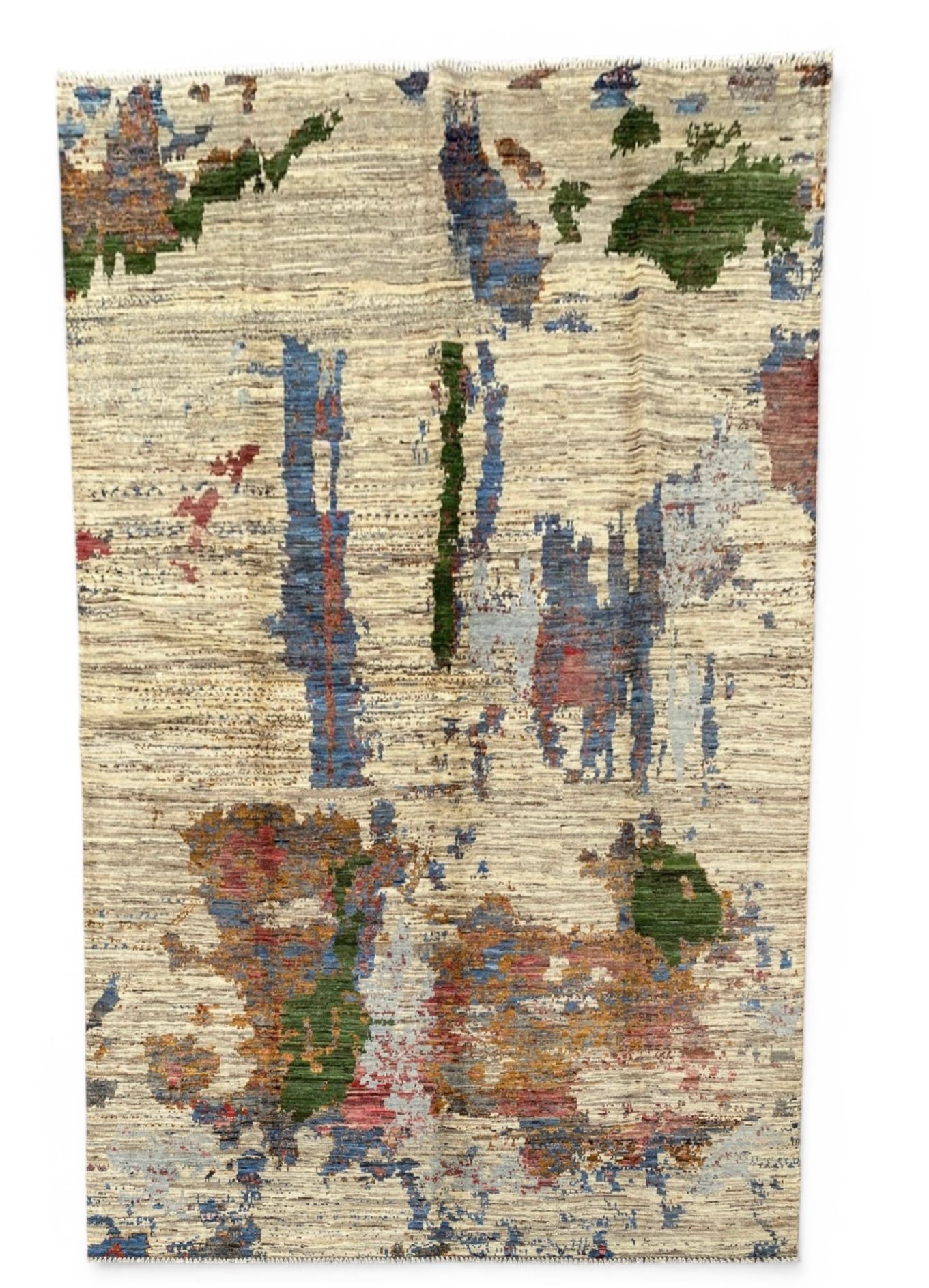 Multicolored abstract patterned rug on a white background