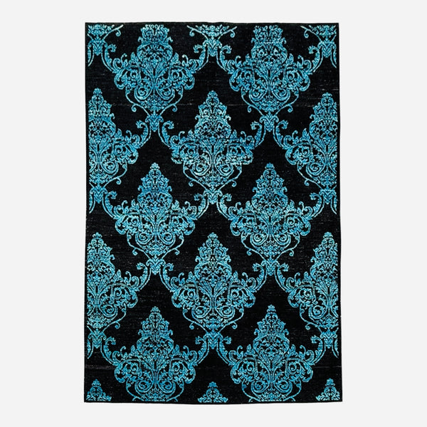 A rectangular area rug featuring a classic damask pattern in vibrant turquoise blue on a solid black background, shown flat against a light gray backdrop.