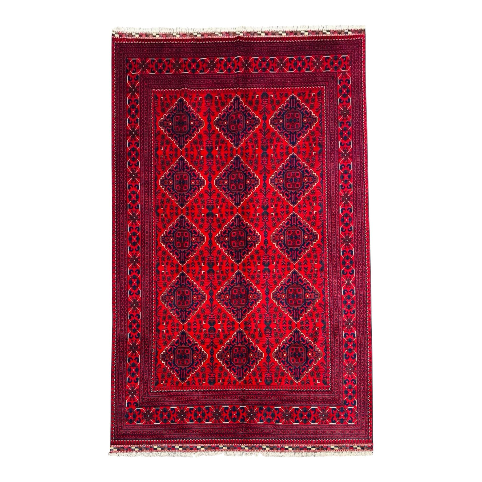 Red patterned rug with geometric design on a white background