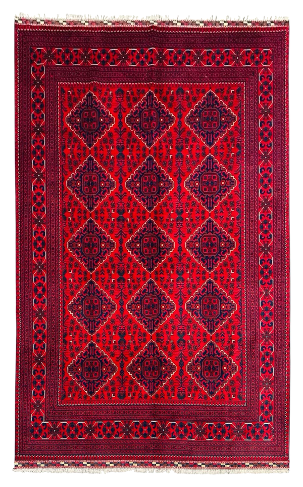 Red patterned rug with geometric design on a white background